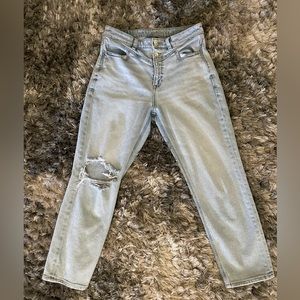 Distressed blue jeans.